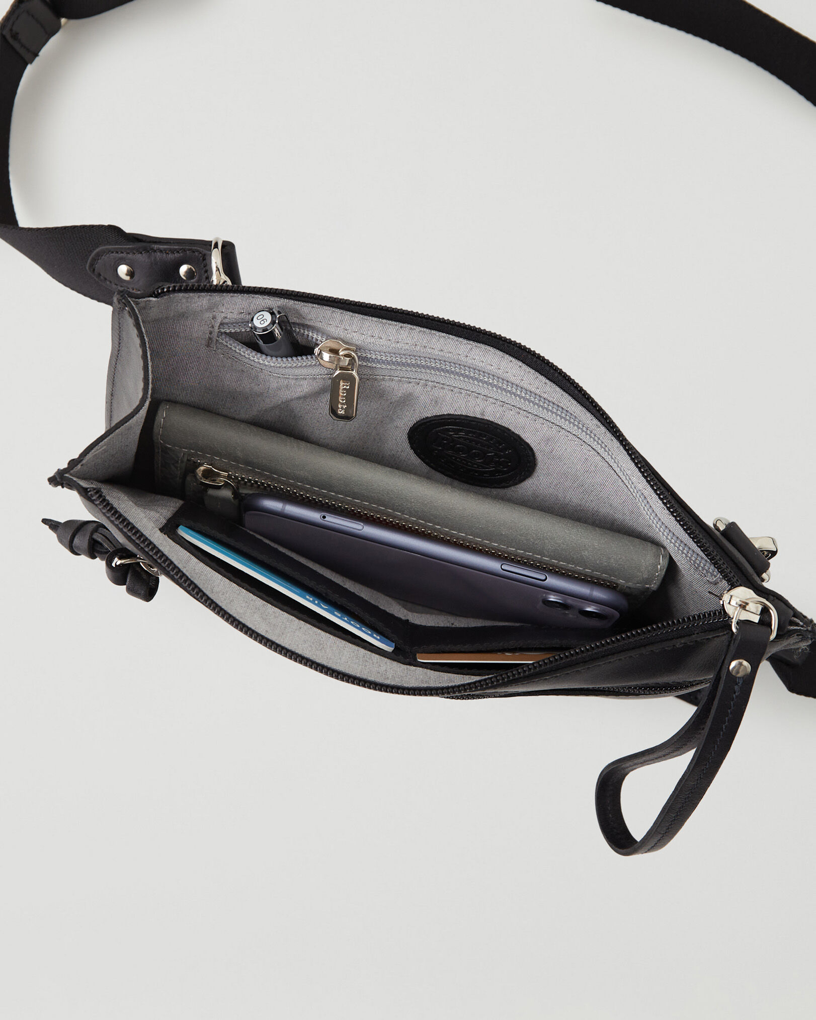 Roots leather crossbody bag on sale