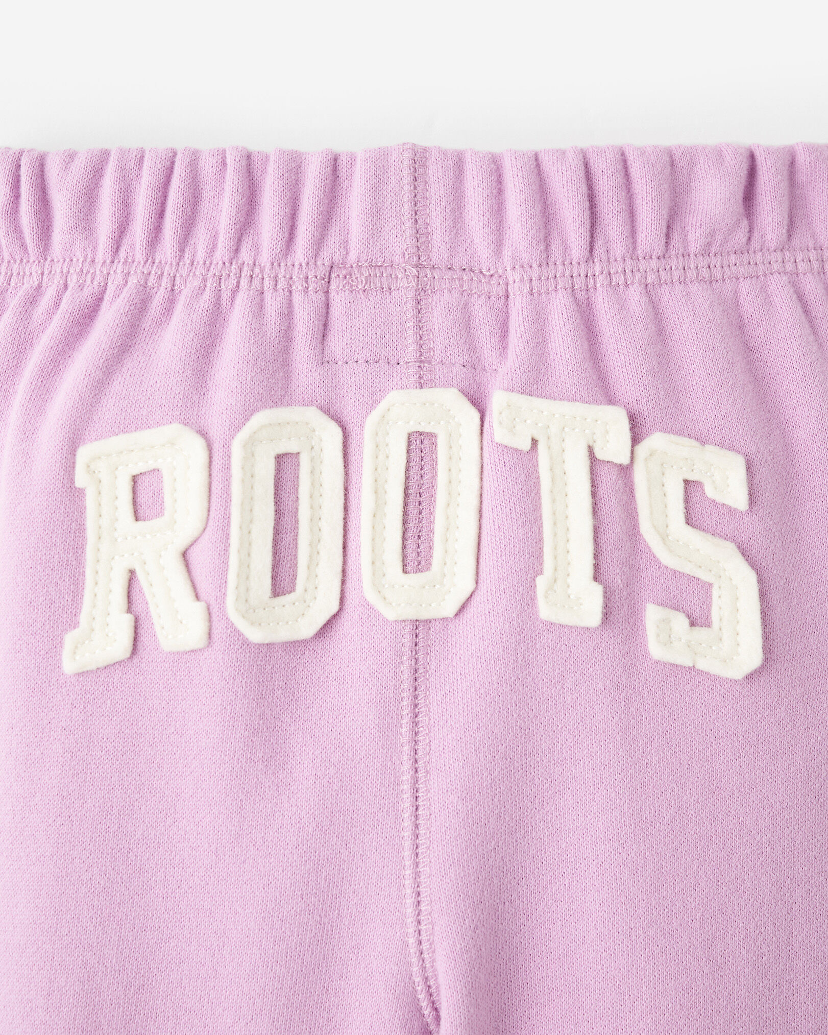 Pink hotsell roots tracksuit