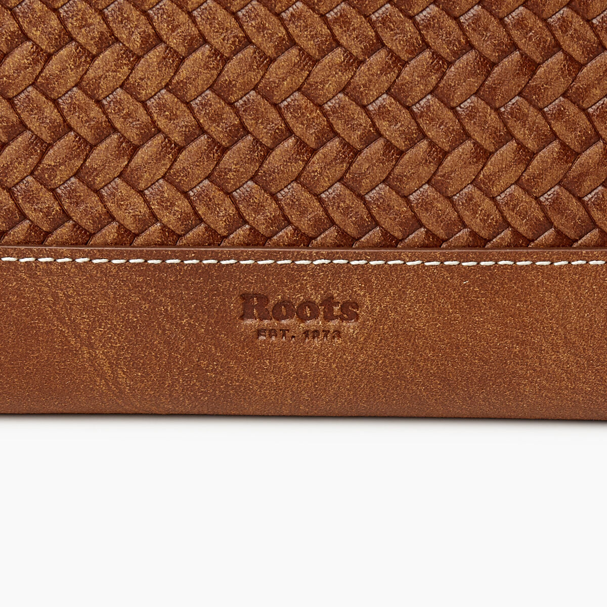 Pochette à glissière en cuir tressé
