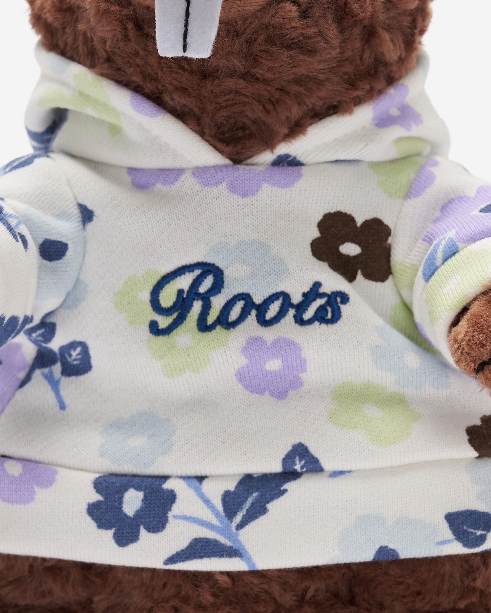 Castor en peluche à motif floral