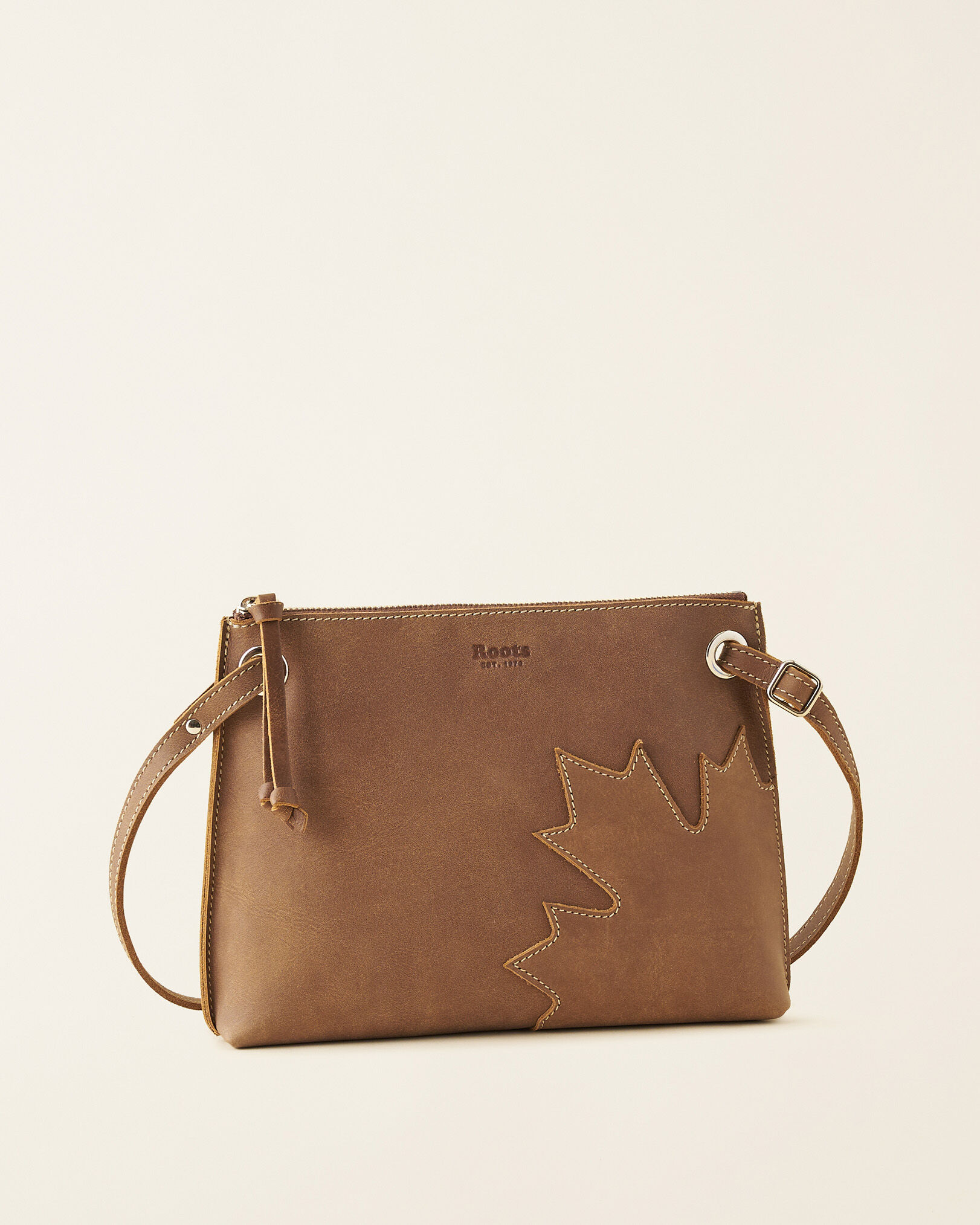 Roots crossbody bag costco online