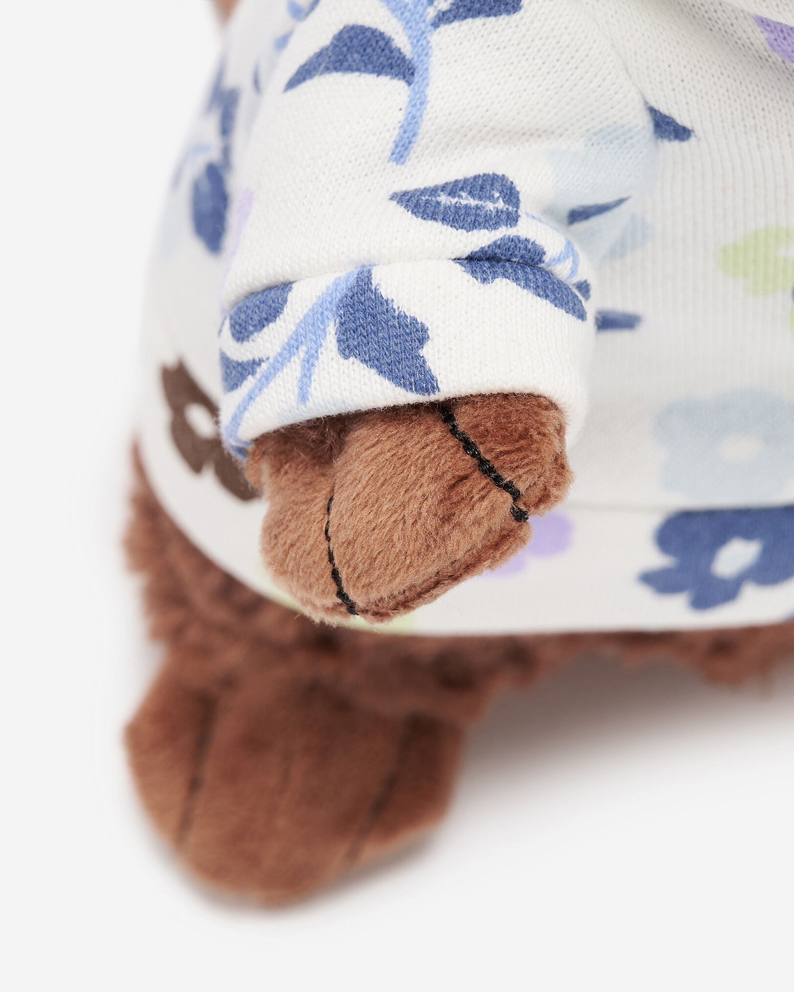Castor en peluche à motif floral