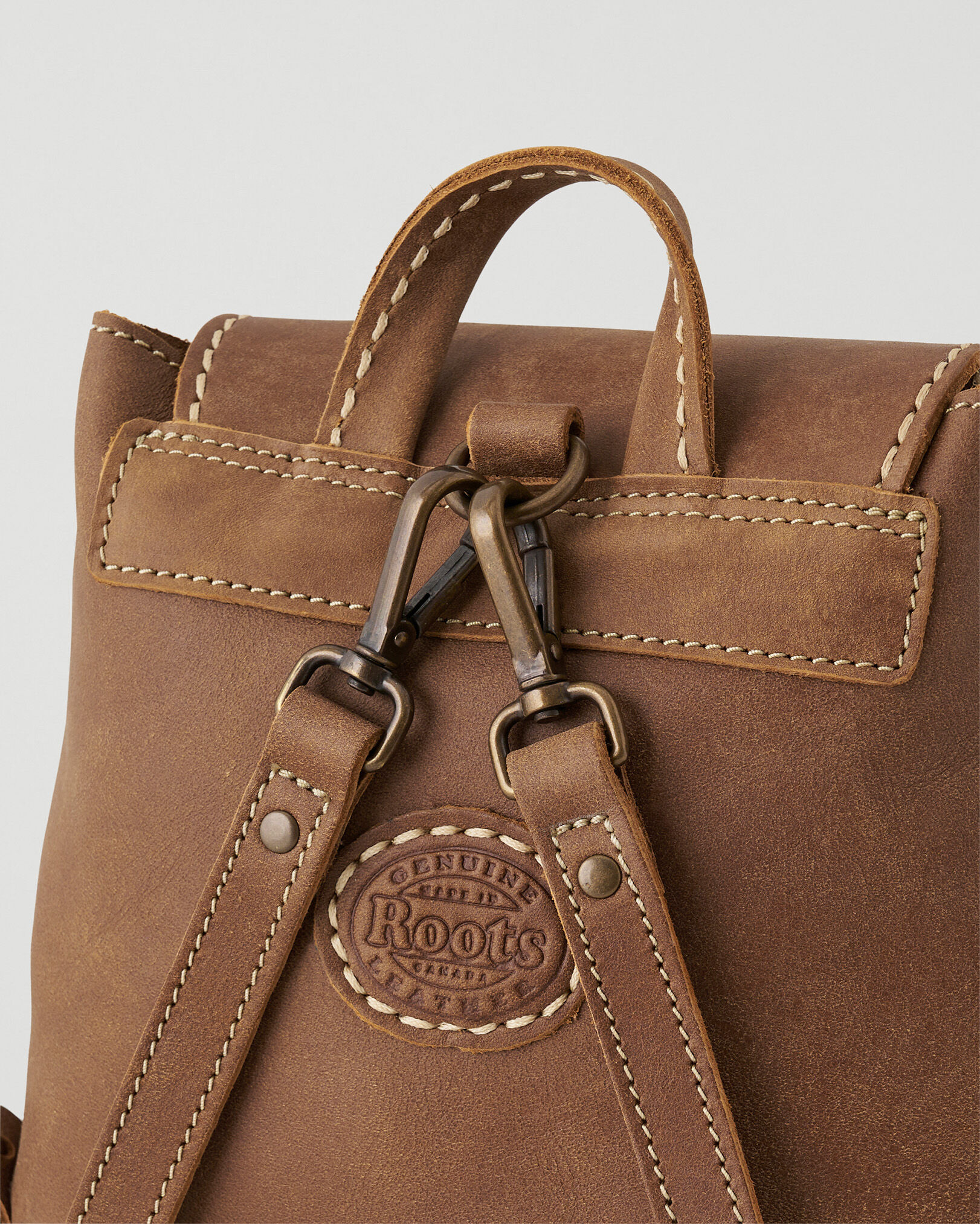 Roots tribe deals leather bag