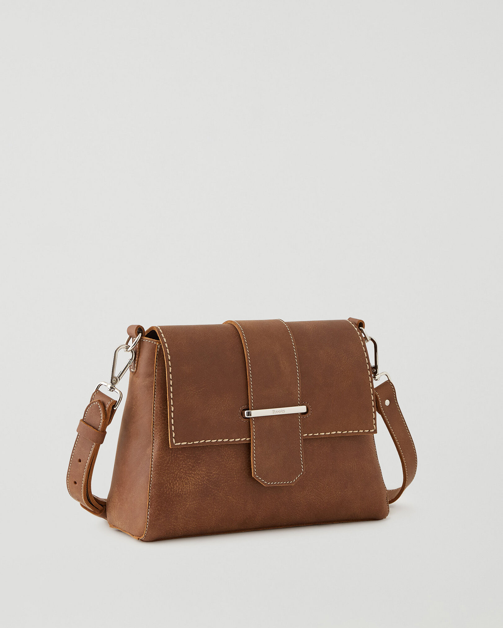 Roots tribe deals leather bag