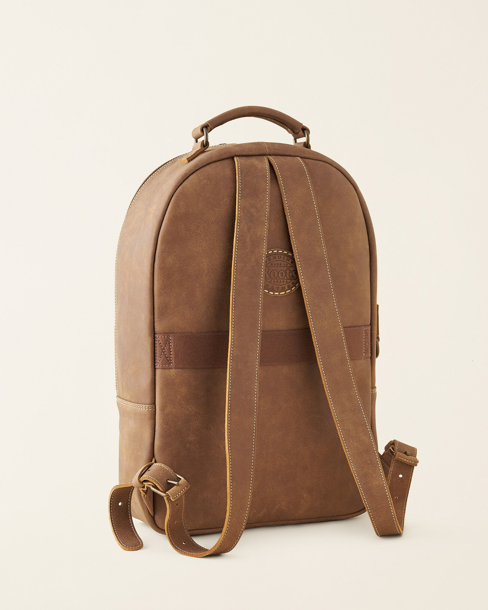 Roots backpack sale purse