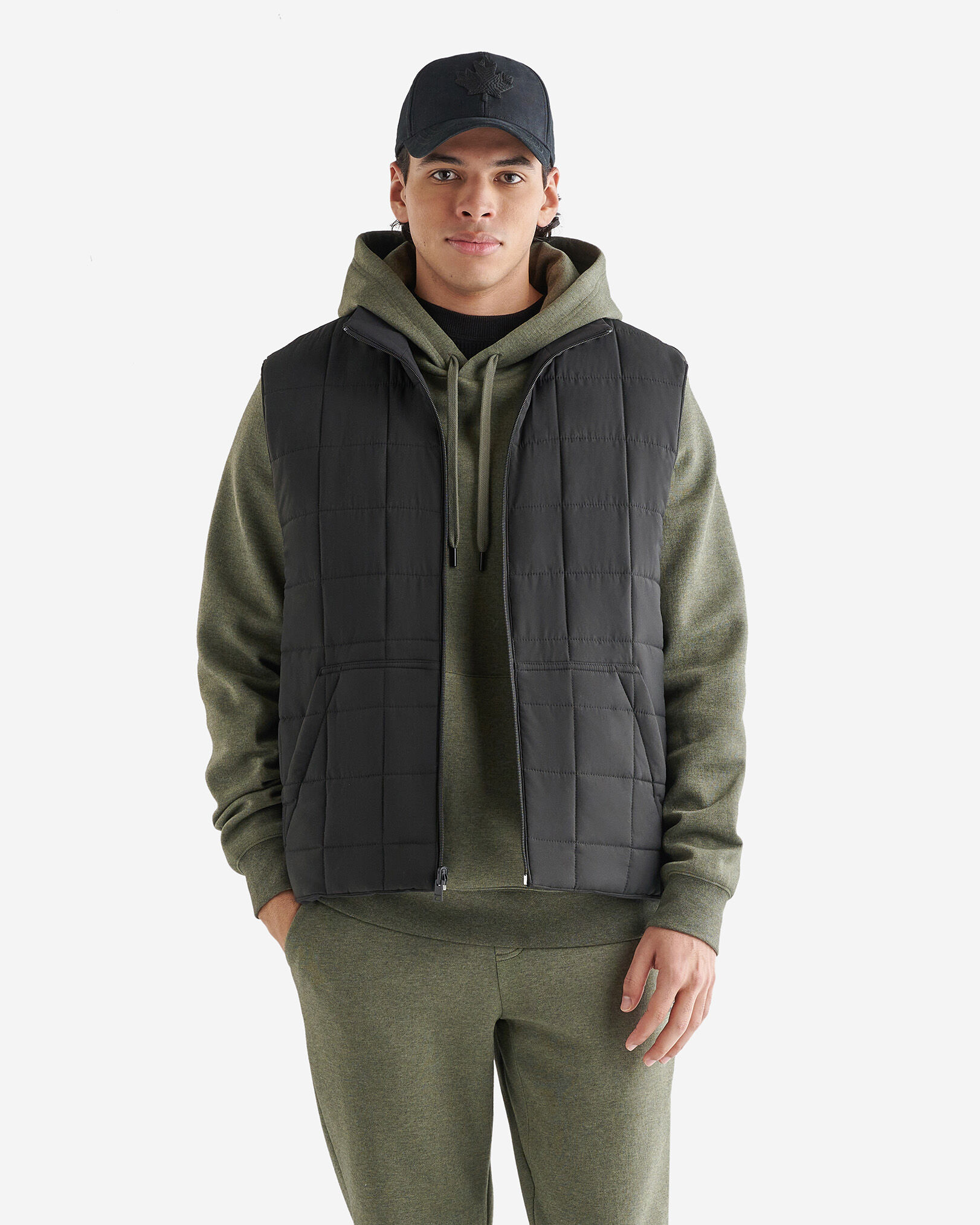Insulated vest with hood outlet