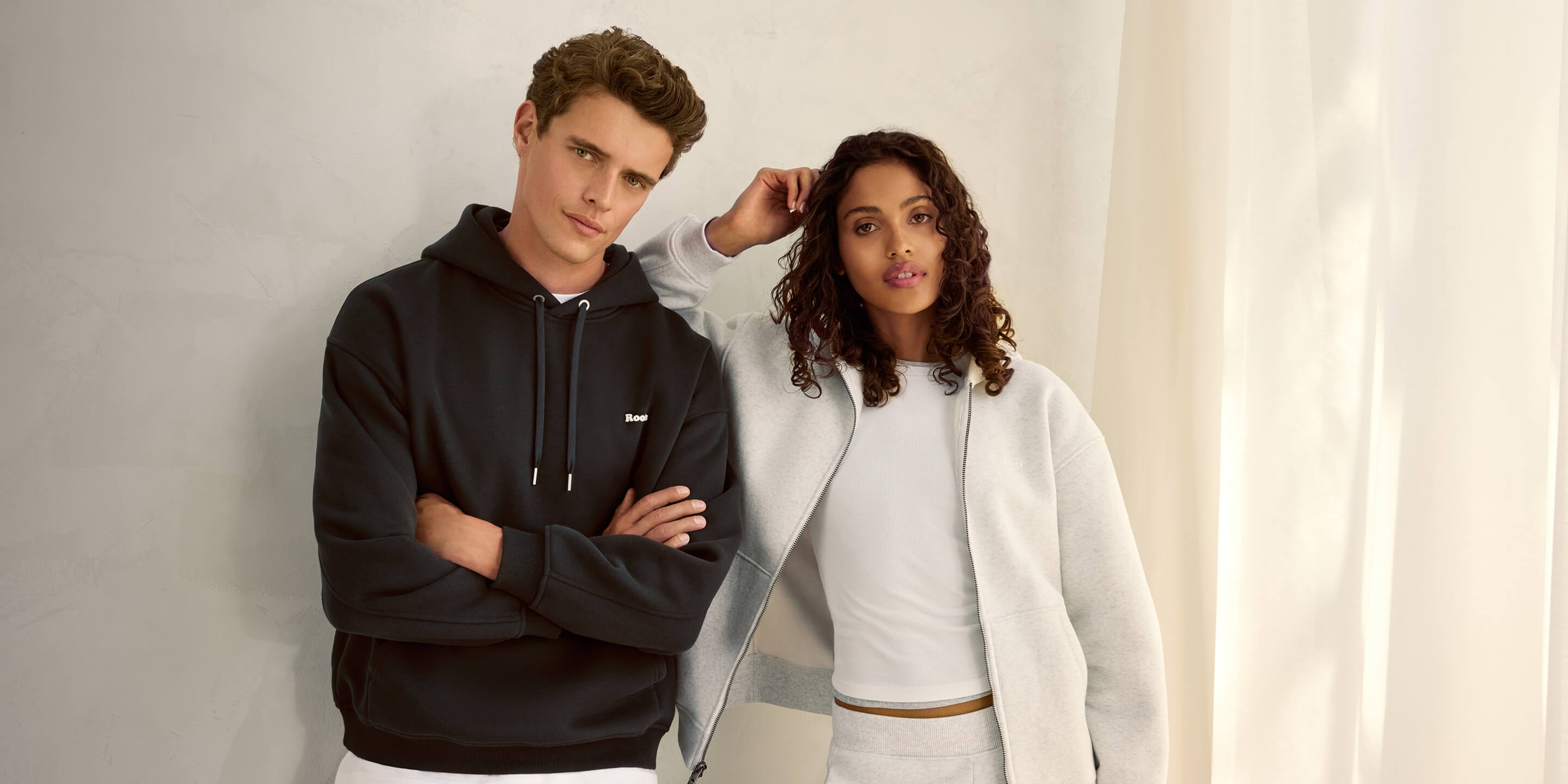 Models wearing black and grey Cloud Sweats