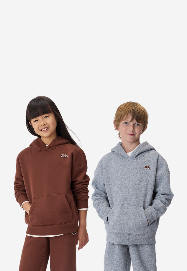 Two kids wearing new Roots fall styles.
