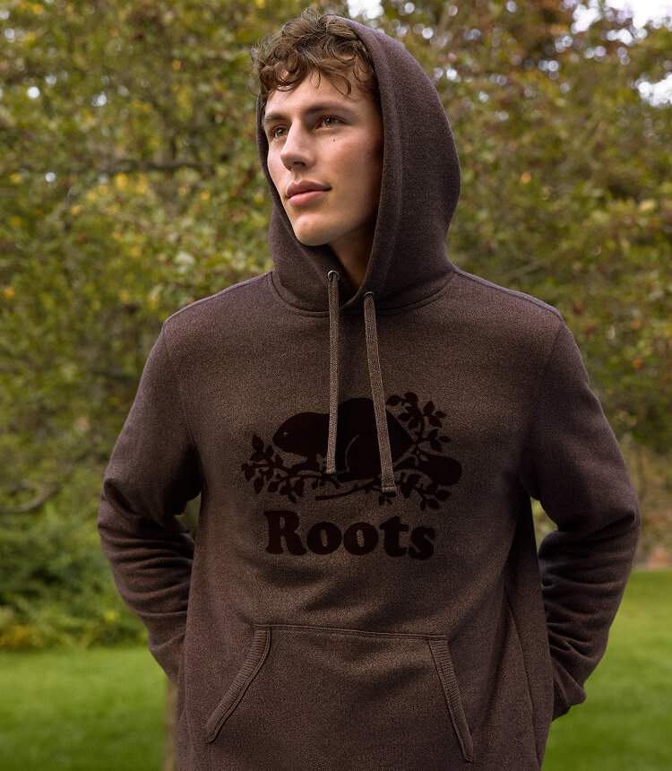 Models wearing Roots sweats.