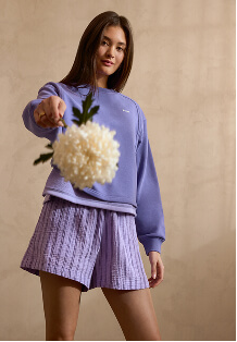 Model wearing a Summer Cloud Crew and gauze shorts.