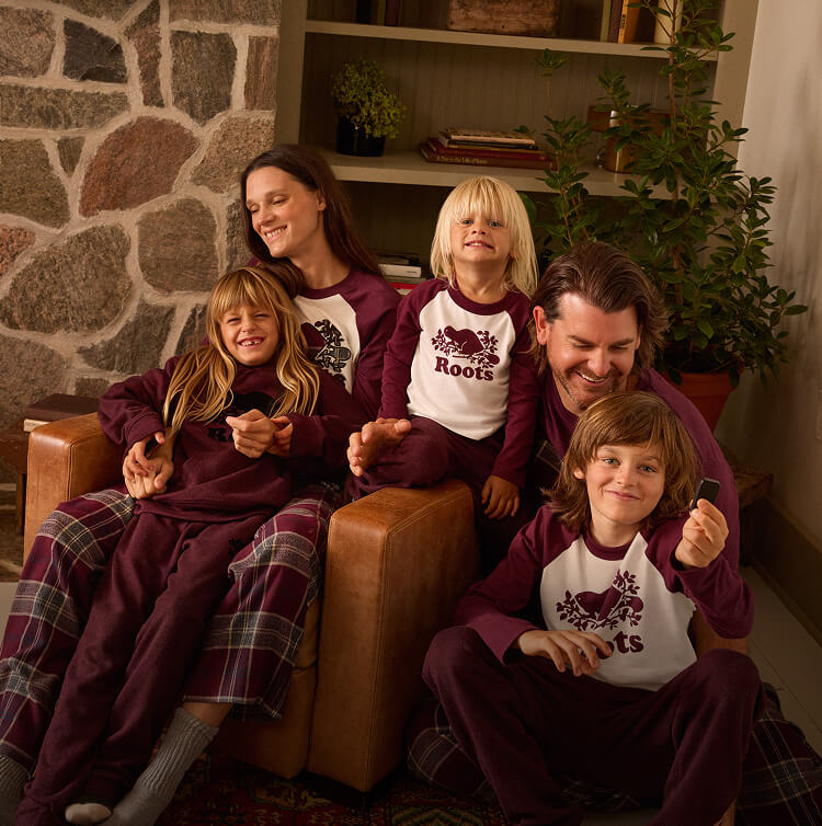 Family wearing matching Roots outfits.
