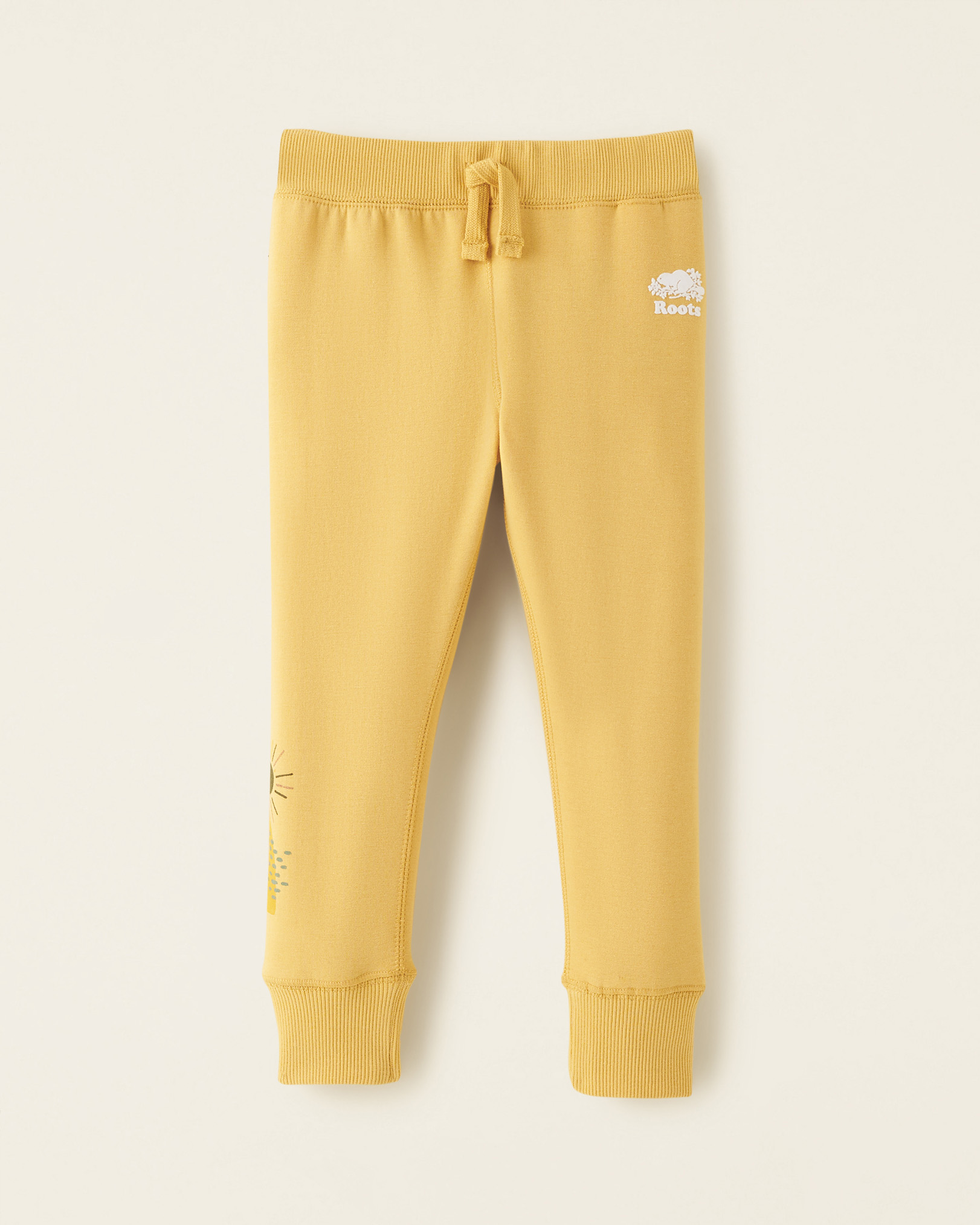 Roots Toddler Girl's Cozy Graphic Slim Sweatpant in Wheat Yellow